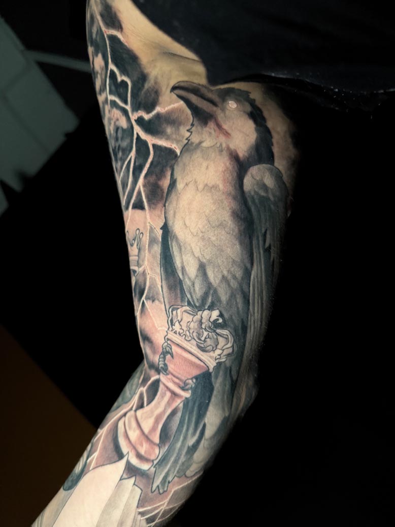 Black Ink Realistic Bird Tattoo