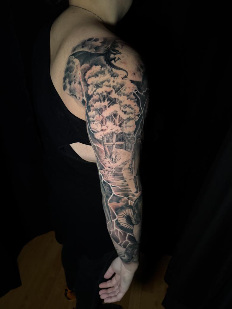 Full black ink tattoo arm sleeve