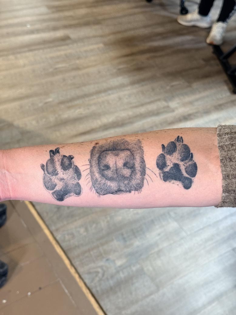 Dog nose and paw print tattoo