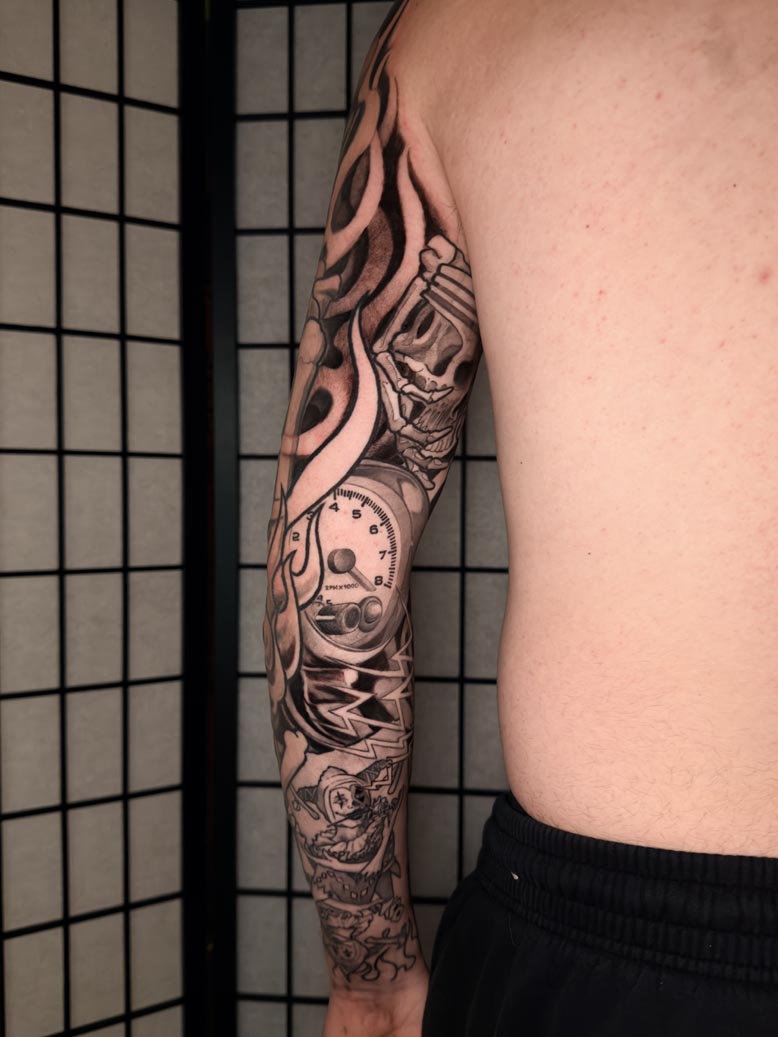 Dali style arm tattoo