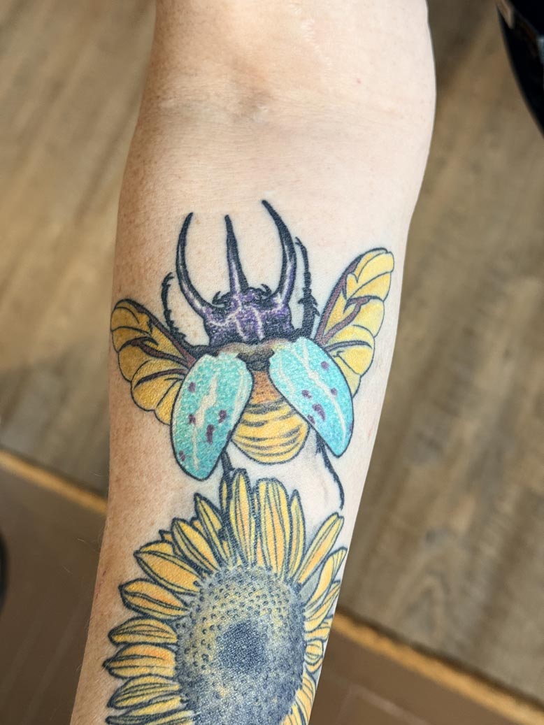 Colorful beetle tattoo