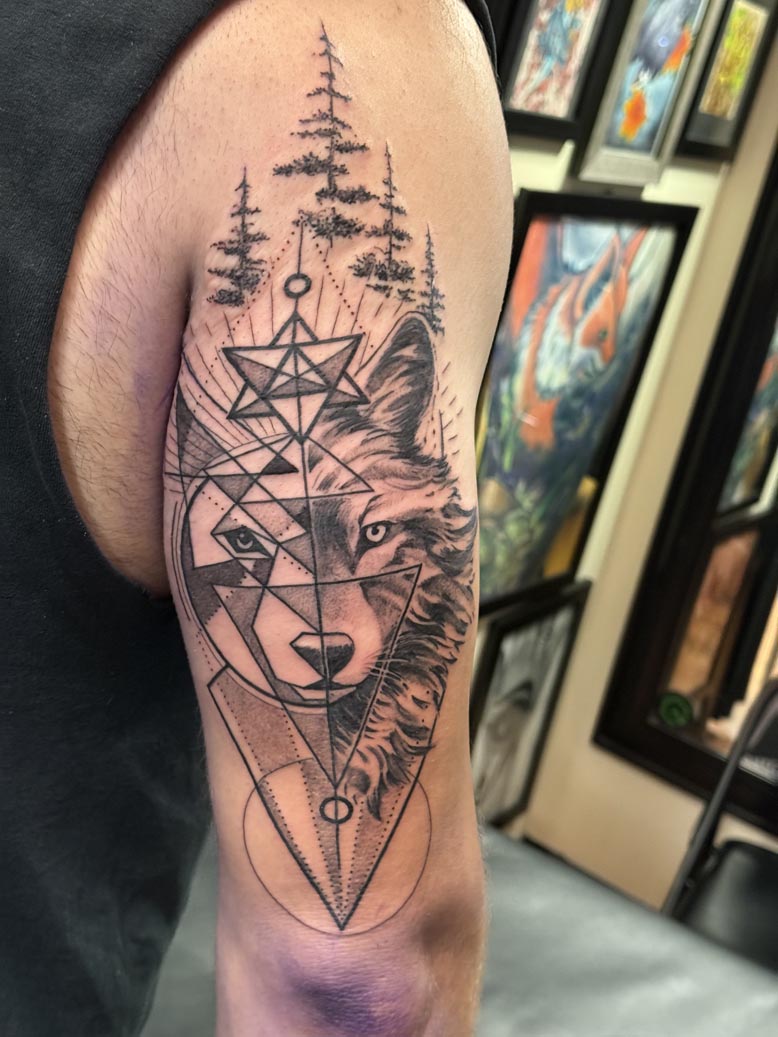 Geometric wolf arm tattoo