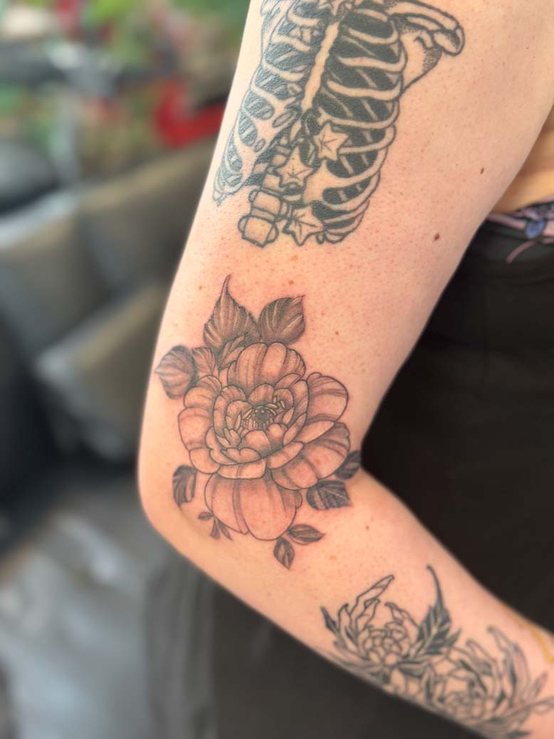 Black ink floral tattoo