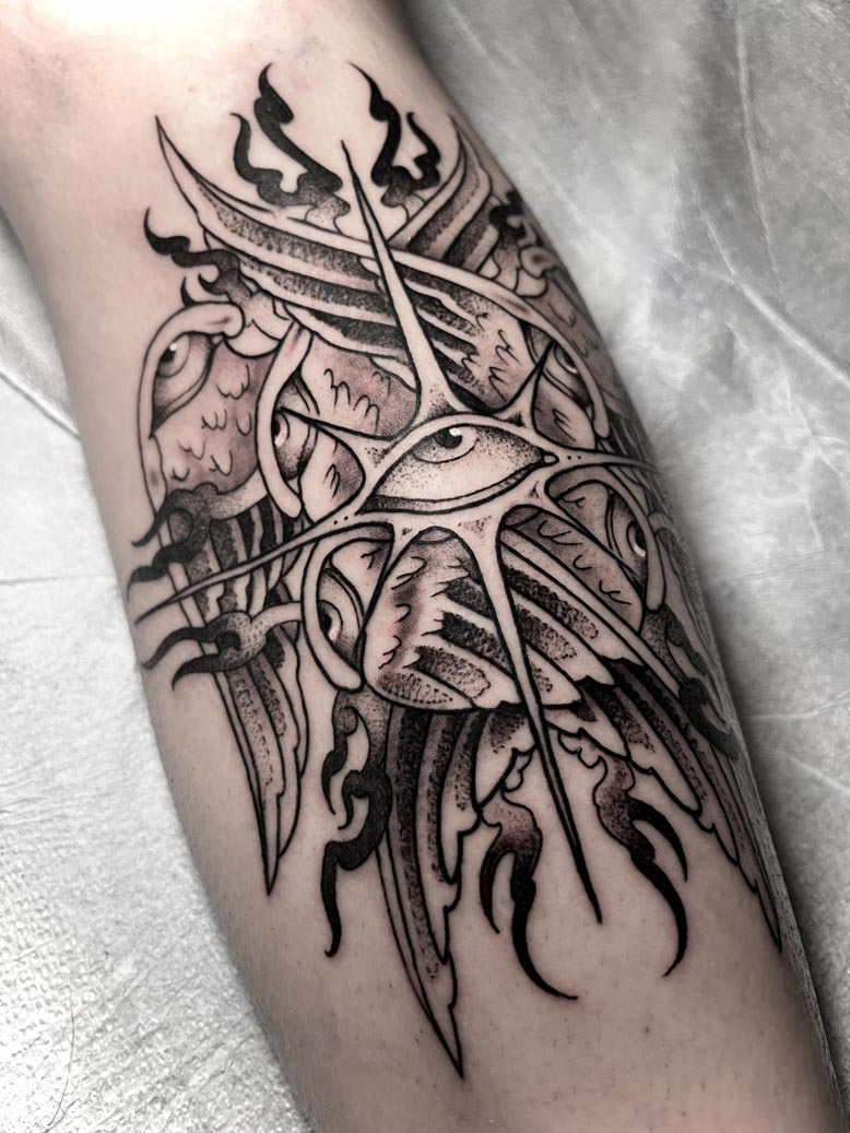 Abstract black ink eye tattoo