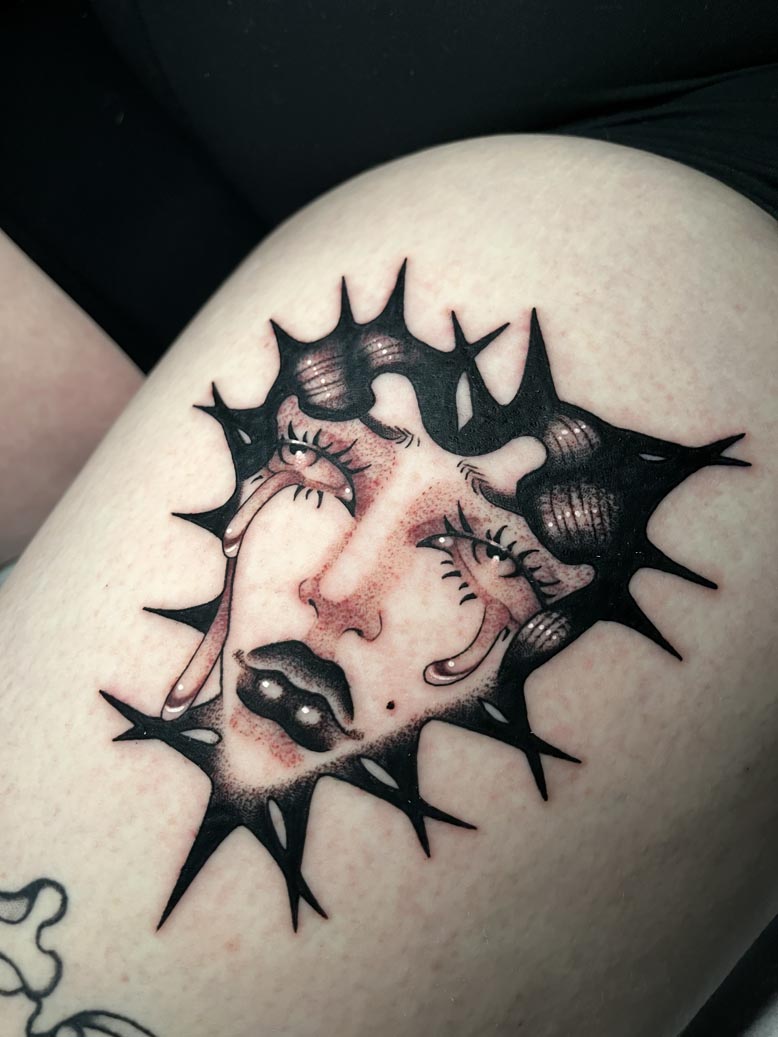 Gothic crying woman thigh tattoo