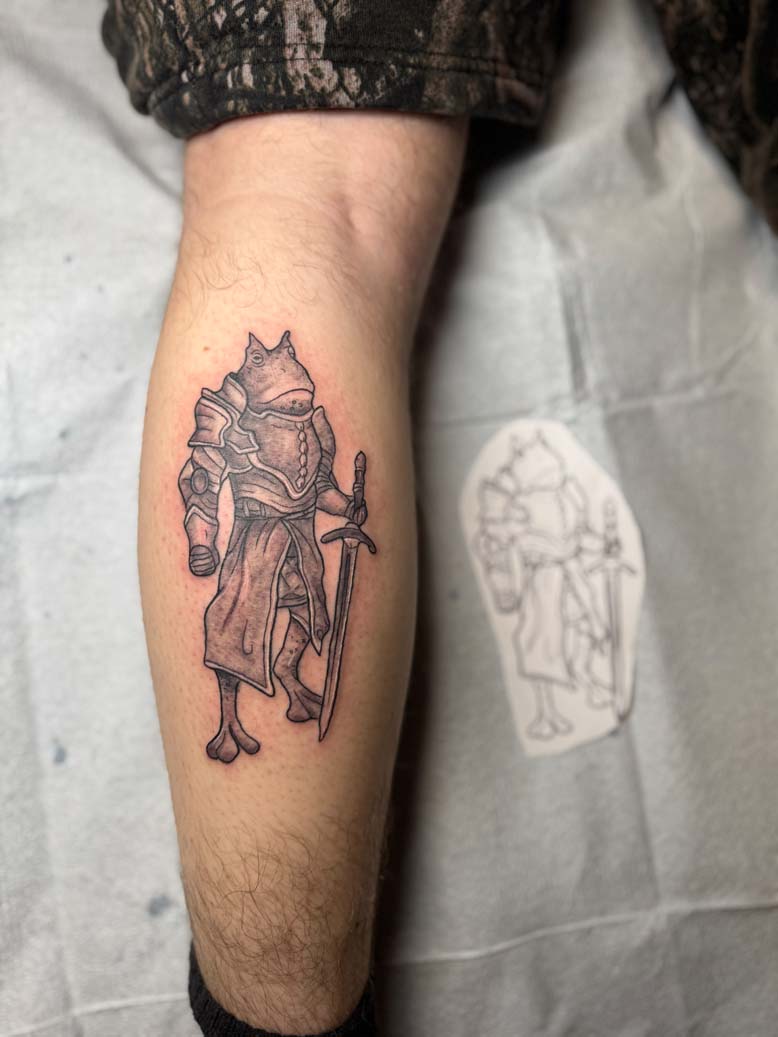 Fresh frog knight tattoo on a calf
