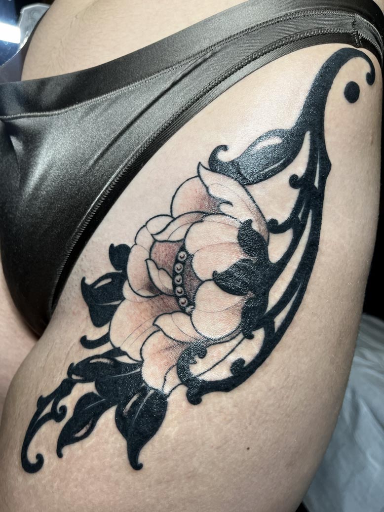 Black flower tattoo
