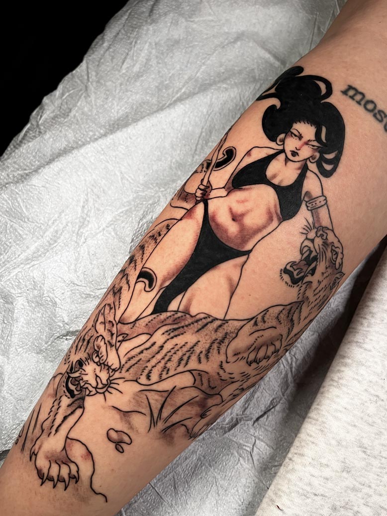 Black ink tattoo of an asian woman and tigers