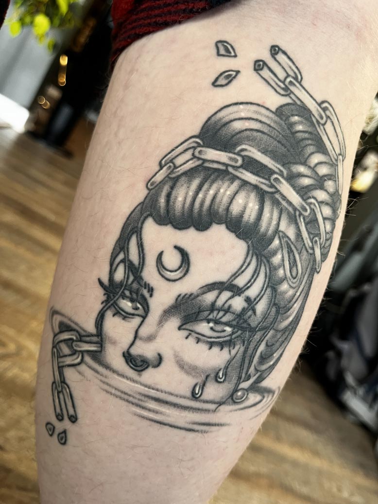 Portrait of a woman with a crescent moon on her forehead