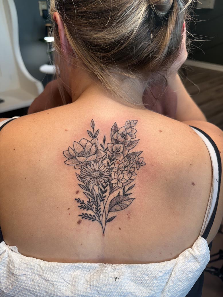 Floral bouquet back tattoo