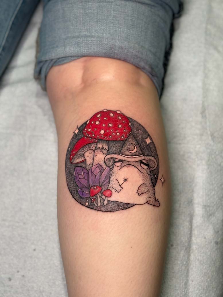 Black and red frog and shroom tattoo