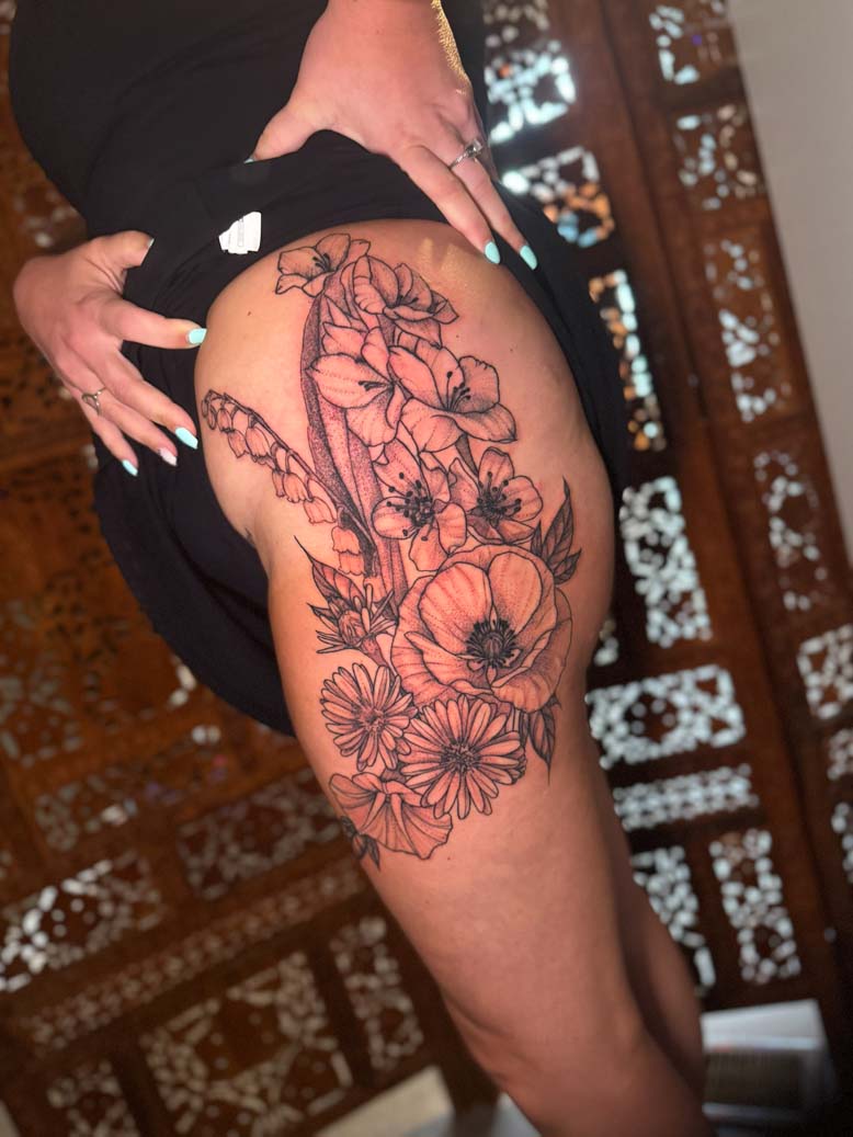 Floral thigh and glute tattoo