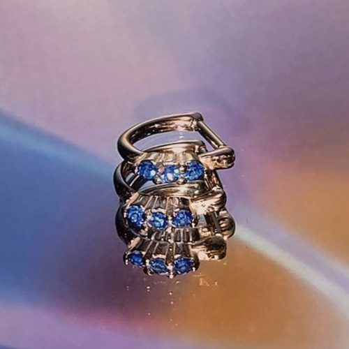 Body jewelry with three blue gems