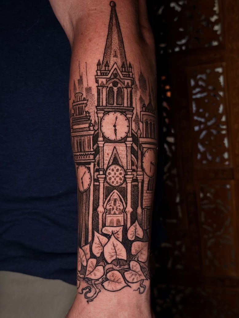 Clock tower arm tattoo