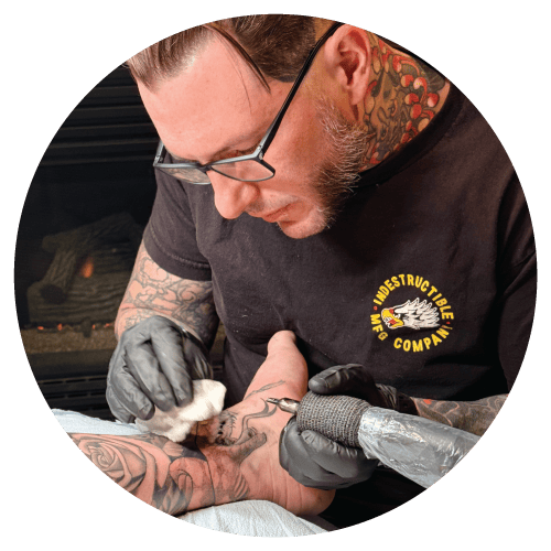 Matt tattooing on an ankle