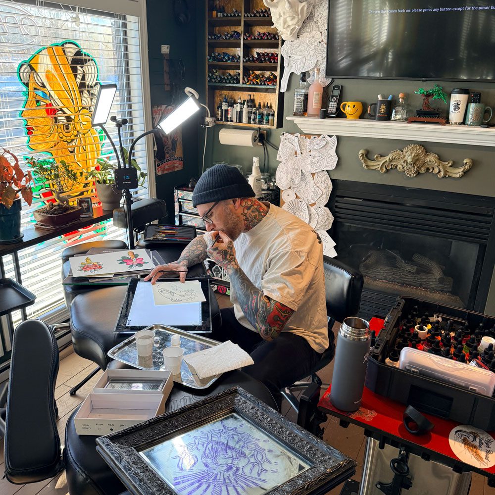 Matt Flanagan working on a tattoo design on a tablet